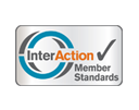 Logo featuring the text "InterAction" with a checkmark and the words "Member Standards" below, in a circular design.